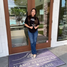 a woman holding an award