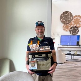 a man holding gifts