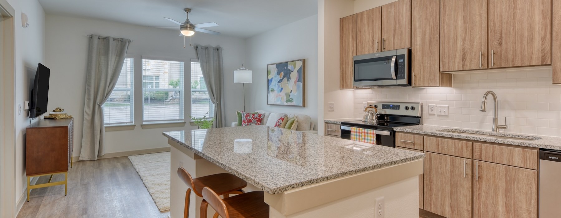 a kitchen with a marble island