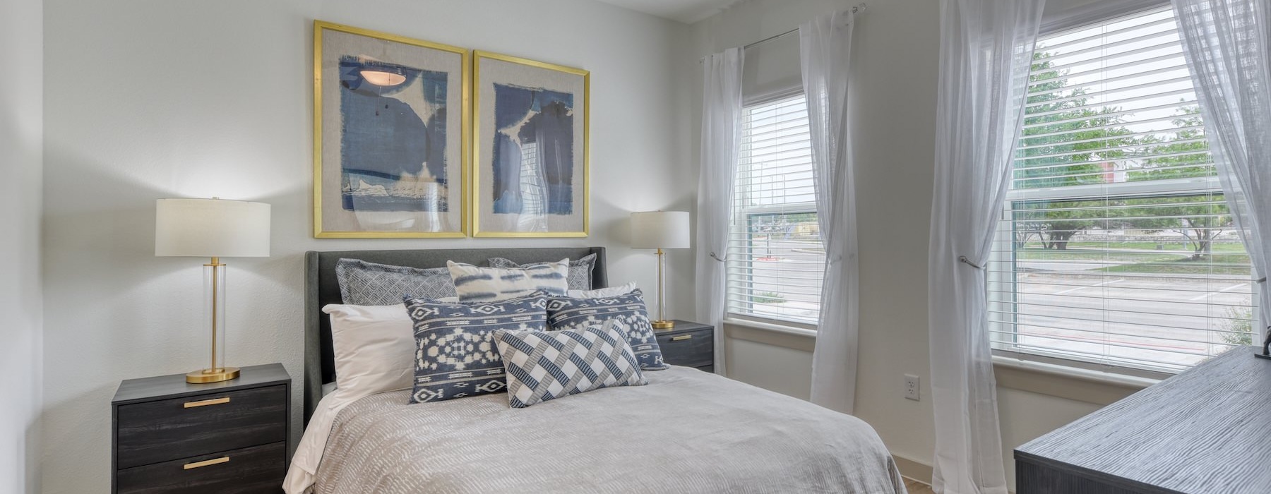 a bedroom with a bed and two nightstands