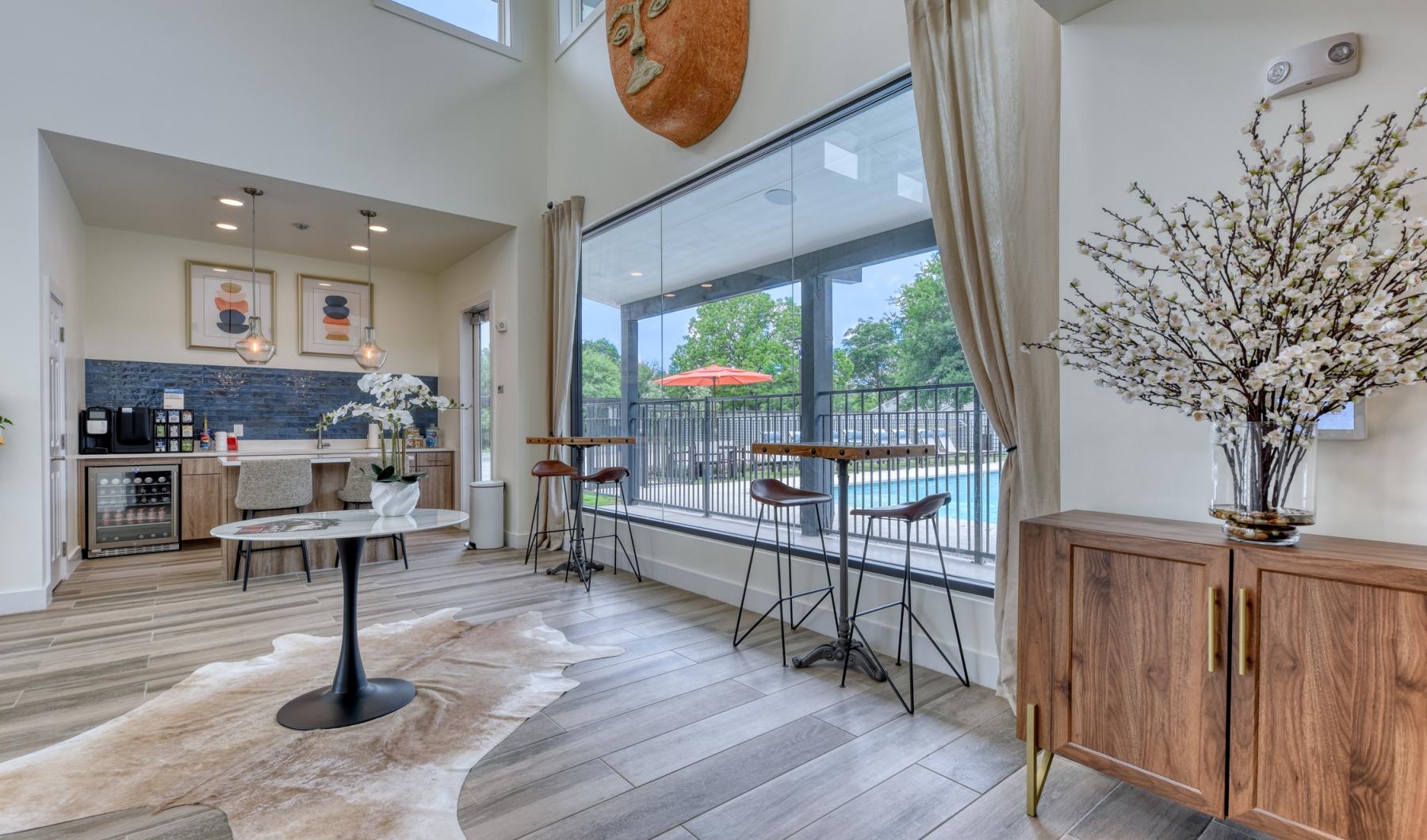 a kitchen with tables and chairs