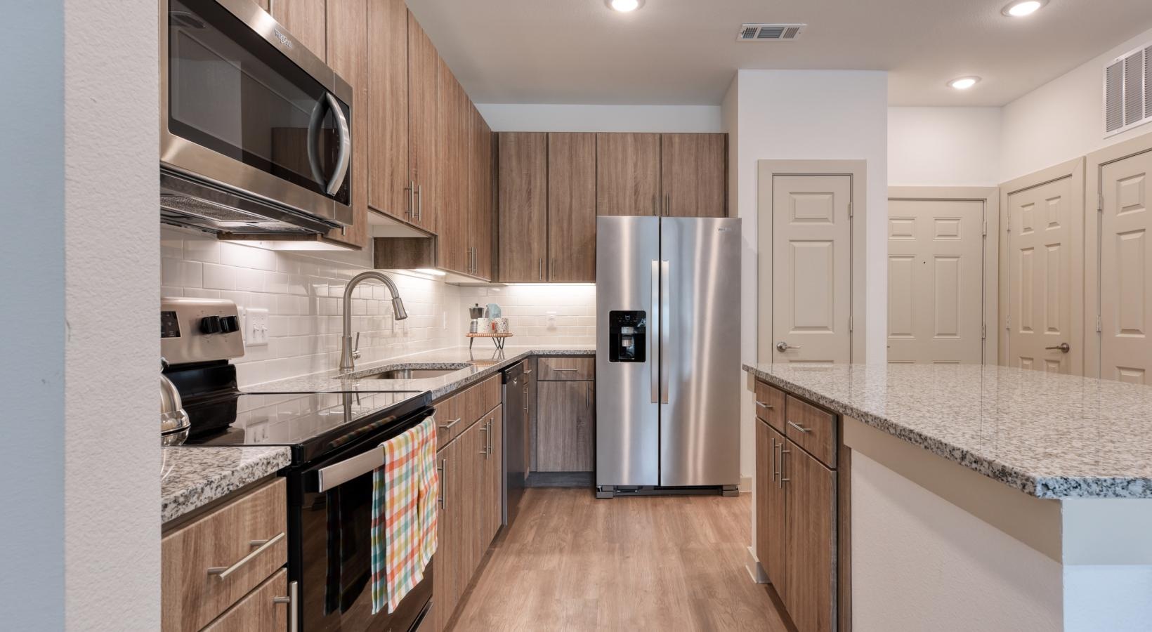 a kitchen with wooden cabinets